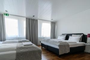 Ένα ή περισσότερα κρεβάτια σε δωμάτιο στο Midtown Hotel