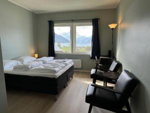 Postel nebo postele na pokoji v ubytování Skibotn Hotel