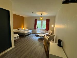 Postel nebo postele na pokoji v ubytování Skibotn Hotel + 5 fotografií