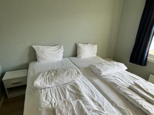 Postel nebo postele na pokoji v ubytování Skibotn Hotel