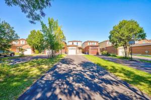 an empty street in front of a house at 4BR Scarborough Gem, Freshly Renovated, 7 Car Parking in Toronto
