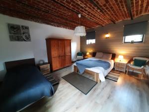 Postel nebo postele na pokoji v ubytování Gîte de l'Espinette