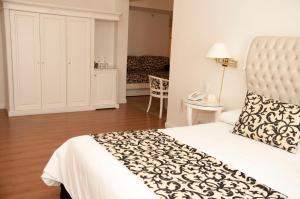 Postel nebo postele na pokoji v ubytování Scala Hotel Buenos Aires