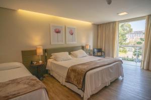 Cama ou camas em um quarto em Grande Hotel Canela