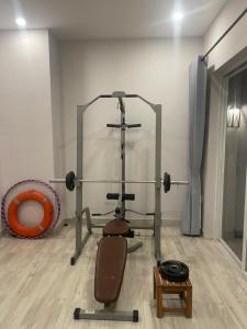 a room with a gym equipment in a room at Homestay Ocean Real in Phan Thiet