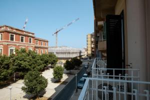 a view of a city street from a balcony at Krisà Apartment in Bari +28 photos