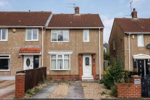 a brown brick house with a white door at 2 Bedroom House in Seaham - Driveway Parking in Seaham