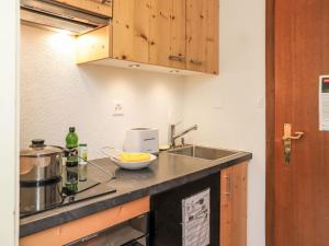 a kitchen with a sink and a counter top at Apartment Rosablanche C22 by Interhome in Siviez