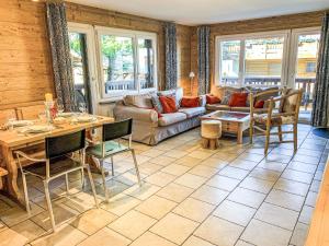 a living room with a couch and a table at Apartment Eden Roc 53 by Interhome in Nendaz +36 photos