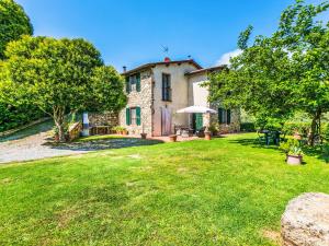 A garden outside Villa Luana by Interhome