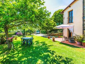 A garden outside Villa Luana by Interhome