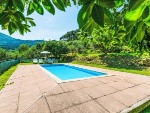 The swimming pool at or close to Villa Luana by Interhome
