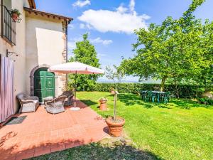A garden outside Villa Luana by Interhome
