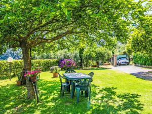 A garden outside Villa Luana by Interhome