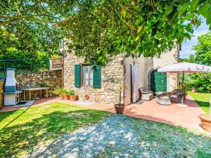 A garden outside Villa Luana by Interhome