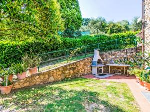 A garden outside Villa Luana by Interhome