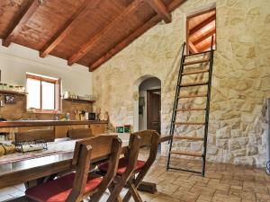 a kitchen with a ladder in a stone wall at Holiday Home Malu Sun II by Interhome in Brodarica