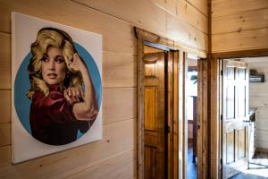 a painting of a woman on a wall at Back In Black in Pigeon Forge +34 photos