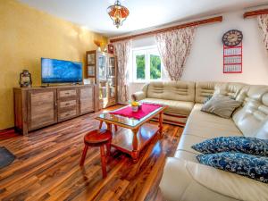 a living room with a couch and a table at Holiday Home Saulja by Interhome in Sveti Juraj
