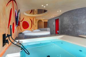 Postel nebo postele na pokoji v ubytování ALFA HOTEL