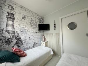 Ένα ή περισσότερα κρεβάτια σε δωμάτιο στο Amko Style Apartamenty Nord 7 z prywatnym ogródkiem Willa Nord