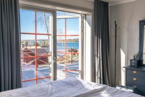 Postel nebo postele na pokoji v ubytování Bergs Gård & Hållsvikens Gård