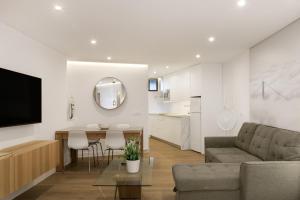 a living room with a couch and a table at Luxury Loft Mar y Sol 2 in Tacoronte