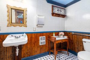 a bathroom with a sink and a toilet at The Historic Reeds Mill Inn in Steubenville +19 photos