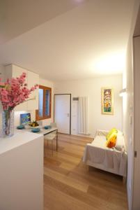 a living room with a bed and a table at Ca' Venissa in Venice