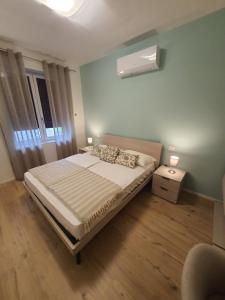 Postel nebo postele na pokoji v ubytování Al Boschetto Rooms