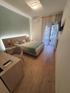 Postel nebo postele na pokoji v ubytování Al Boschetto Rooms