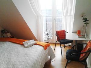Postel nebo postele na pokoji v ubytování Roskilde B&B