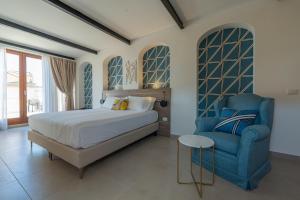 Postel nebo postele na pokoji v ubytování Boutique Hotel Palazzo Donna Iulia