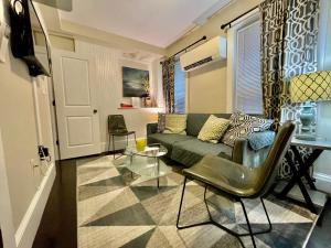 a living room with a couch and a table at Beautiful 3BR 3BA Duplex parking Best Location Boston in Boston