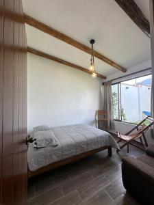 En eller flere senge i et værelse på Casa de campo, Caraz, Ancash LUAL COTTAGE + 7 billeder