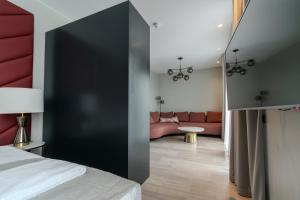 Ένα ή περισσότερα κρεβάτια σε δωμάτιο στο Midtown Hotel