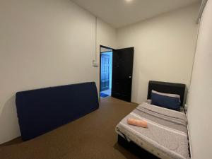 a room with two bunk beds and a mirror at ML Homestay in Lahad Datu