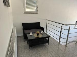 a small room with a table and a chair at Rooms Soldo in Međugorje