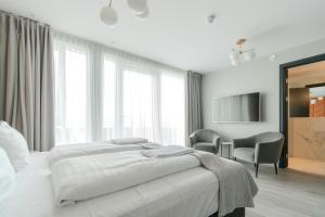 Ένα ή περισσότερα κρεβάτια σε δωμάτιο στο Midtown Hotel