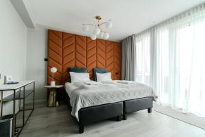 Ένα ή περισσότερα κρεβάτια σε δωμάτιο στο Midtown Hotel