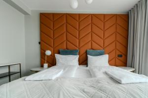 Ένα ή περισσότερα κρεβάτια σε δωμάτιο στο Midtown Hotel