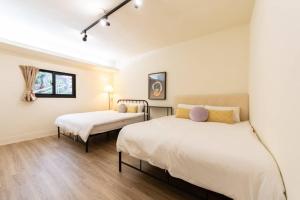 Voodi või voodid majutusasutuse 土象星座包棟住宿 toas