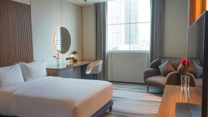 Cama ou camas em um quarto em Waymore Hotel Spa & Casino