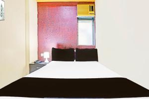Postel nebo postele na pokoji v ubytování Hotel new shree niwas