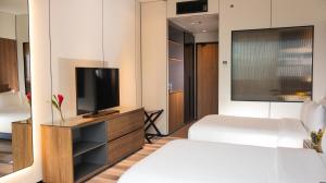 Cama ou camas em um quarto em Waymore Hotel Spa & Casino