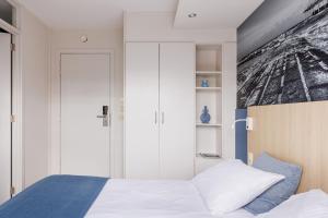 Postel nebo postele na pokoji v ubytování Enjoy Hotel Noordzee - Paradisio By WP Hotels