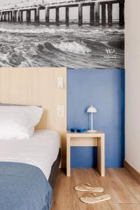 Postel nebo postele na pokoji v ubytování Enjoy Hotel Noordzee - Paradisio By WP Hotels