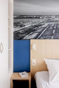 Postel nebo postele na pokoji v ubytování Enjoy Hotel Noordzee - Paradisio By WP Hotels