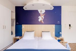 Postel nebo postele na pokoji v ubytování Enjoy Hotel Noordzee - Paradisio By WP Hotels