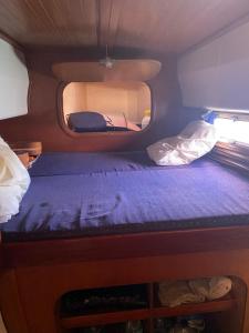 Postel nebo postele na pokoji v ubytování Cabine catamaran Baie de Ste Anne
